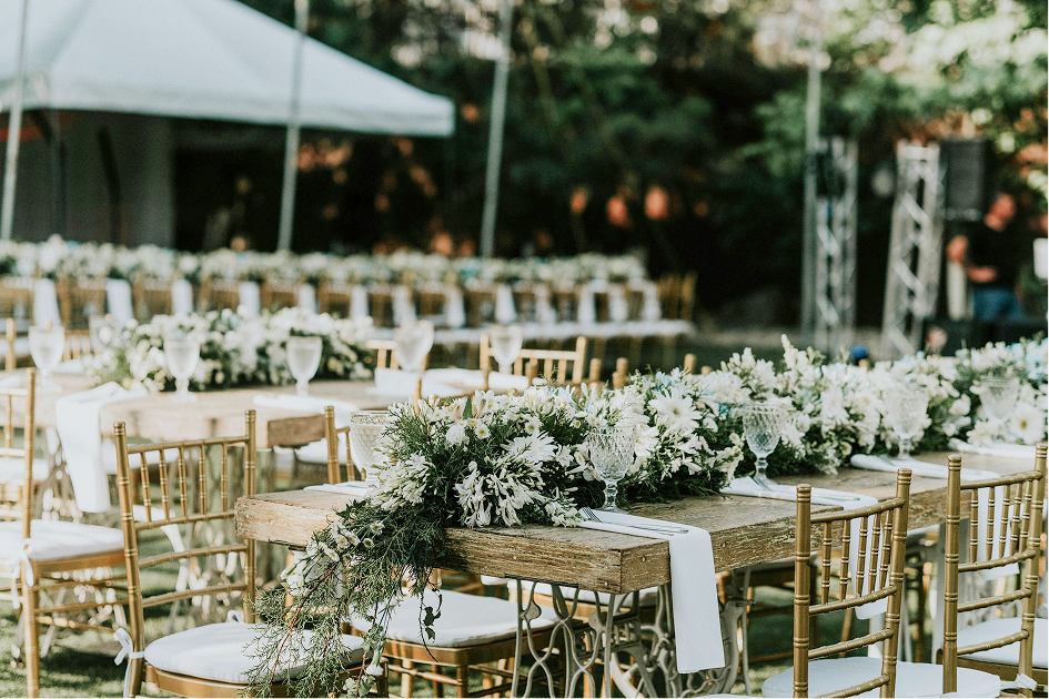 Outdoor reception tables arranged for a shared gathering